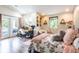 Bright bedroom with light walls, wood floors, balcony access, and natural light at 16603 Hutchison Rd, Odessa, FL 33556