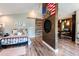 Bright bedroom showcases a barn door, vaulted ceiling, and a patriotic wall art at 16603 Hutchison Rd, Odessa, FL 33556