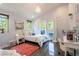 Bright bedroom with a balcony and views of the outside at 16603 Hutchison Rd, Odessa, FL 33556