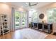 Sunlit dog room with outdoor access and stylish dog kennel at 16603 Hutchison Rd, Odessa, FL 33556