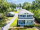 Charming two-story home featuring a beautiful lake view and a well-manicured front yard at 16603 Hutchison Rd, Odessa, FL 33556