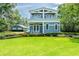 Attractive home features a manicured lawn and landscaping, two-story facade, and complementing detached garage at 16603 Hutchison Rd, Odessa, FL 33556