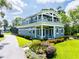 Charming two-story home with a manicured lawn and landscaped garden beds at 16603 Hutchison Rd, Odessa, FL 33556