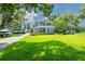 Beautiful home featuring boat trailer parking, mature trees, and separate guest house on the lush property at 16603 Hutchison Rd, Odessa, FL 33556