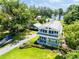 An inviting two-story home boasts a well-kept lawn and a convenient boat on the driveway at 16603 Hutchison Rd, Odessa, FL 33556