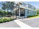 A view of the exterior of the home and the screened-in pool area with patio furniture at 16603 Hutchison Rd, Odessa, FL 33556