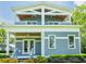 Classic home with a welcoming front porch with double doors, wood ceiling and manicured flower bed at 16603 Hutchison Rd, Odessa, FL 33556