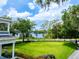 Beautiful green lawn overlooking the lake on a bright, sunny day at 16603 Hutchison Rd, Odessa, FL 33556