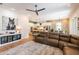 Open-concept living room with a modern kitchen, stylish decor, and comfortable seating arrangement at 16603 Hutchison Rd, Odessa, FL 33556