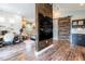 A modern open living space featuring kitchenette and bedroom spaces with wood flooring at 16603 Hutchison Rd, Odessa, FL 33556