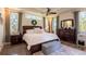 Tranquil main bedroom with natural light, a king-size bed, and wood furniture at 16603 Hutchison Rd, Odessa, FL 33556