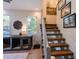 Modern stairway featuring metal railings and a landing with a view at 16603 Hutchison Rd, Odessa, FL 33556