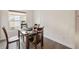 Bright dining area with a wooden table set and natural light streaming through the window at 1700 Ironwood E Ct, Oldsmar, FL 34677