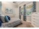 Bedroom with two windows and patterned curtains with view of the pool at 17724 Daisy Farm Dr, Lutz, FL 33559