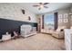 Charming Bedroom with floral wallpaper, a white crib, and a cozy armchair for a relaxing space at 17724 Daisy Farm Dr, Lutz, FL 33559