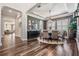Dining room boasting wood floors, a round table, gray walls, and decorative trim at 17724 Daisy Farm Dr, Lutz, FL 33559