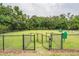This fenced dog park offers plenty of room for dogs to run and play, with benches for dog parents at 17724 Daisy Farm Dr, Lutz, FL 33559