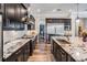 Well-appointed kitchen with granite countertops, stainless steel appliances, and ample cabinet space at 17724 Daisy Farm Dr, Lutz, FL 33559