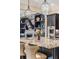 Kitchen island featuring granite counters, pendant lights, and room for seating at 17724 Daisy Farm Dr, Lutz, FL 33559