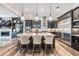 Gourmet kitchen features granite countertops, stainless steel appliances, and pendant lighting at 17724 Daisy Farm Dr, Lutz, FL 33559