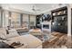 Spacious living area features a cozy fireplace, built-in shelving, and large windows for natural light at 17724 Daisy Farm Dr, Lutz, FL 33559
