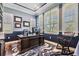 Bright office featuring a large desk, custom shelving, and plantation shutters at 17724 Daisy Farm Dr, Lutz, FL 33559