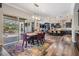 Open floorplan that connects dining room and kitchen space with access to outdoor screened-in patio at 17724 Daisy Farm Dr, Lutz, FL 33559