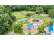 This aerial view showcases the community playground, dog park and covered picnic areas for residents' enjoyment at 17724 Daisy Farm Dr, Lutz, FL 33559