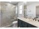 Beautiful bathroom with a double vanity, a mosaic-tiled shower, and modern fixtures for a luxurious experience at 1820 Rumar Ln, Holiday, FL 34691
