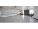 Bright and spacious three car garage with ample room for parking and storage at 1820 Rumar Ln, Holiday, FL 34691