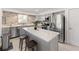Modern kitchen with stainless steel appliances, quartz countertops, and stylish backsplash, perfect for cooking at 1820 Rumar Ln, Holiday, FL 34691