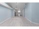 Open-concept layout showcases modern design, connecting living, dining, and kitchen areas for versatile living at 1820 Rumar Ln, Holiday, FL 34691