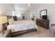 Tranquil bedroom with wood floors, a ceiling fan, and ample natural light, offering a cozy and inviting space at 1820 Rumar Ln, Holiday, FL 34691
