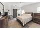 Serene bedroom with a barn door, plush bedding, and ample closet space, creating a relaxing retreat at 1820 Rumar Ln, Holiday, FL 34691