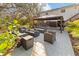 Outdoor patio seating area with fire pit and natural view at 1820 Rumar Ln, Holiday, FL 34691