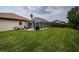 The backyard has an enclosed patio, perfect for barbecuing and entertaining, with lots of green space at 2143 Edelweiss Loop, Trinity, FL 34655