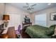 Bedroom with dark hardwood floors, ceiling fan, and neutral paint offers a calming space at 2143 Edelweiss Loop, Trinity, FL 34655
