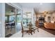 Cozy breakfast nook with a glass table, and backyard pool views through sliding doors at 2143 Edelweiss Loop, Trinity, FL 34655