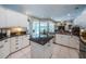 Open kitchen layout with stainless steel appliances and granite countertops, flowing into the living area at 2143 Edelweiss Loop, Trinity, FL 34655