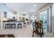 Bright kitchen featuring granite countertops, stainless steel appliances, and a breakfast bar at 2143 Edelweiss Loop, Trinity, FL 34655