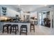 Bright kitchen featuring granite countertops, stainless steel appliances, and a breakfast bar at 2143 Edelweiss Loop, Trinity, FL 34655