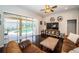 Bright living room with hardwood floors and sliding doors to the screened patio and backyard pool at 2143 Edelweiss Loop, Trinity, FL 34655