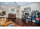 Open-concept living room with hardwood floors and a view of the dining area at 2143 Edelweiss Loop, Trinity, FL 34655