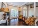 Spacious living room with hardwood floors, arched windows, and recessed lighting at 2143 Edelweiss Loop, Trinity, FL 34655