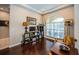 Inviting living room featuring hardwood floors, ample natural light, and stylish decor at 2143 Edelweiss Loop, Trinity, FL 34655