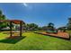 Community playground with slides, swings, and a picnic shelter, designed for Gathering fun and recreation at 2143 Edelweiss Loop, Trinity, FL 34655