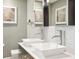 Bathroom with dual sinks, modern fixtures, decor and lighting at 2511 W Morrison Ave, Tampa, FL 33629