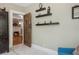 Entryway featuring decorative shelves and ornate door with view into a living room with fireplace at 2511 W Morrison Ave, Tampa, FL 33629