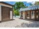 Outdoor area featuring brick paved patio, pool, and a charming pool house with awning at 2511 W Morrison Ave, Tampa, FL 33629