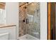 Features custom tiling in a glass enclosed shower adding a unique design to the space at 2511 W Morrison Ave, Tampa, FL 33629
